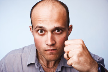 pensive young man in shirt
