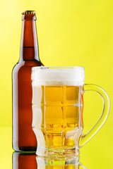 Beer mug and bottle isolated on white background