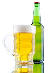 Beer mug and bottle isolated on white background