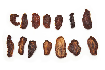 Sun dried tomato's isolated on a white background.