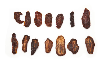 Sun dried tomato's isolated on a white tsuido background.