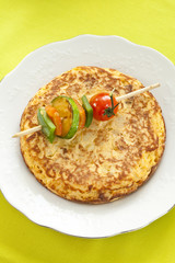 omelette with grilled vegetable skewer