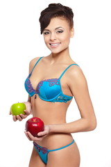 smiling woman in  lingerie with green and red apple