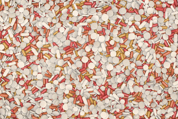top view of many different drugs and pills in white and orange