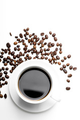 cup of coffee with coffee grains isolated on white