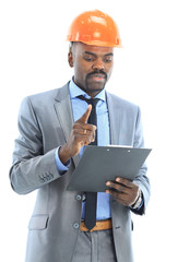 Confident ethnic architect wearing a hardhat against