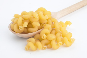 Macaroni in wooden spoon
