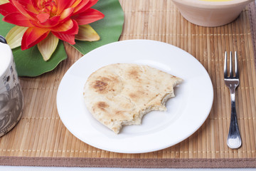 Half loaf of bread in a dish