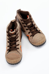 A pair of new hiking boots on white background