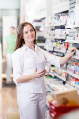 Female Standing in Pharmacy