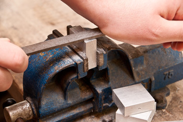 Grinding a block of metal
