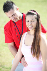 girl and boy doing exercises outdoors