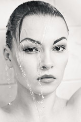 Young girl portrait with water. Black and white