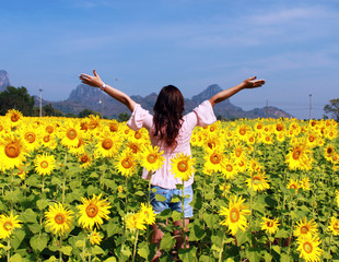 Women in the field of sunflowers