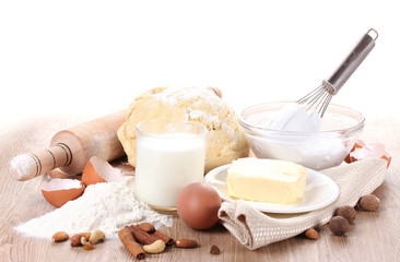 Ingredients for the dough wooden table on white background
