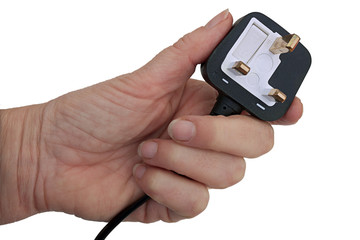 British standard 3 pin plug in hand, isolated over white