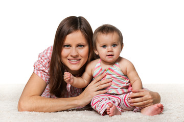 Cheerful baby girl with smiling mother