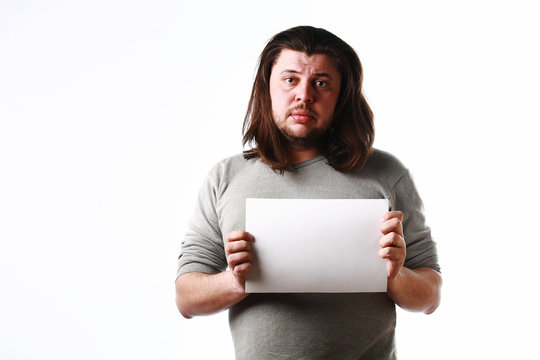Upset man with empty sheet of paper