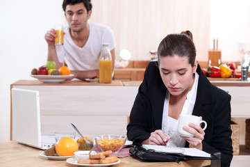 young active couple having breakfast