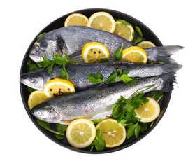 Fresh fishes with lemon, parsley and pepper