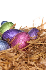 Straw nest with chocolate Easter eggs
