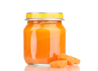 Jar of baby puree with carrot isolated on white