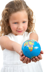 Young girl looking at earth sphere.
