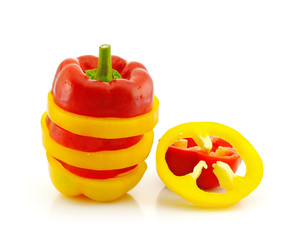 sliced colored peppers arranged in an exagerated stack