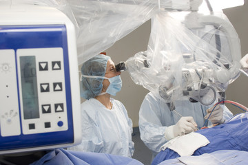 Surgeon Using Operating Microscope