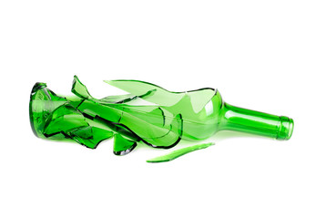 Shattered green wine bottle isolated on the white background