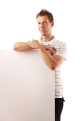 A smiling man with a blank isolated on white background