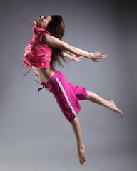 beauty girl dance on grey background