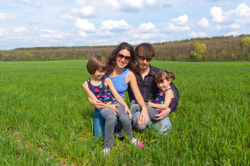 Happy family outdoors having fun on vacation