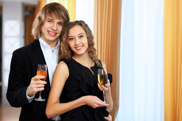 Couple in a restaurant with shampagne
