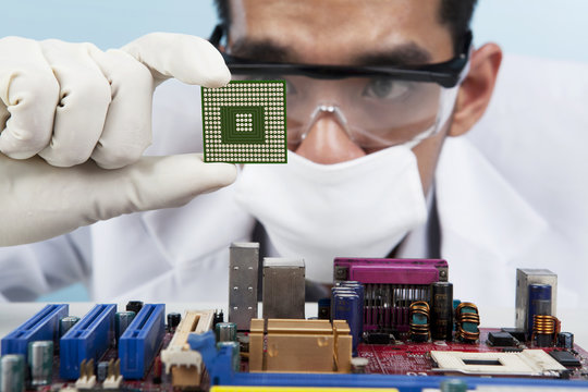 Scientist holding a Computer Microchip