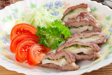 meat filled with bacon and cheese, tomatoes, parsley