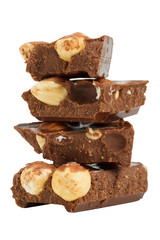 stack of chocolate pieces  with hazelnuts, close up isolated on