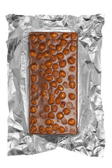 chocolate bar with hazelnuts in aluminum foil
