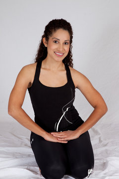 woman in exercise outfit smiling