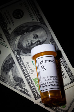 Pill Bottle And Dollar