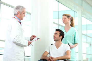 Doctor with patient in wheelchair