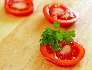 Fresh sliced tomato with water drops on it