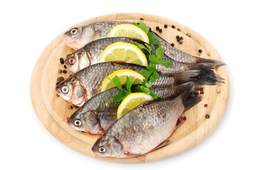 Fresh fishes with lemon, parsley and spice