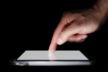 Pointing finger on a digital tablet