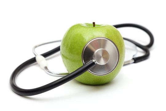 stethoscope and green apple