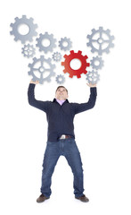 man shows gear to success