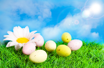 Easter card. Multi-colored eggs against the sky