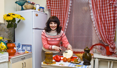 Woman in kitchen cooking