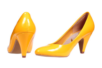 A pair of yellow women's heel shoes with clipping path.