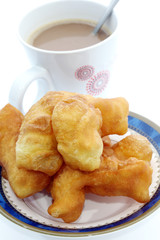 Deep-fried dough stick and coffee
